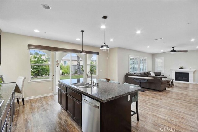 45976 Camino Rubi, Temecula, CA 92592 - kitchen featuring a sink, stainless steel dishwasher, dark brown cabinetry, healthy amount of natural light, and recessed lighting