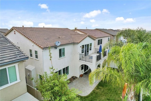 45976 Camino Rubi, Temecula, CA 92592 - back of house featuring a balcony, stucco siding, a tiled roof, and a patio area