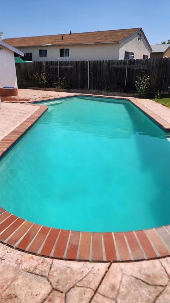 3999 Arey Dr, San Diego, CA 92154 - view of swimming pool with a fenced backyard and a patio area