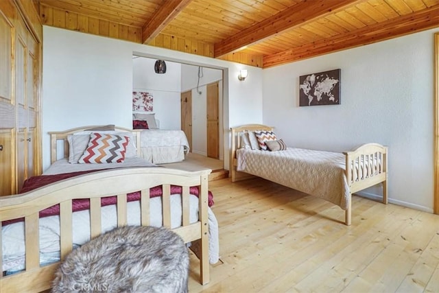 1954 Nob Hill Dr, Running Springs, CA 92382 - bedroom with wood ceiling with exposed beams, light wood-type flooring, and baseboards