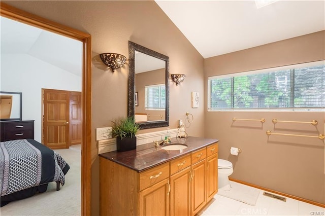 1954 Nob Hill Dr, Running Springs, CA 92382 - bathroom with lofted ceiling, vanity, and toilet