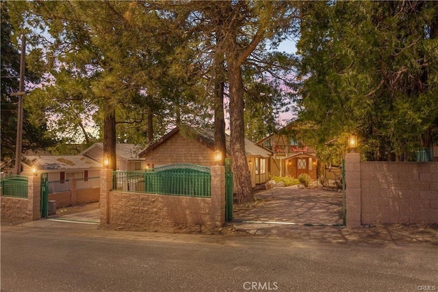 1954 Nob Hill Dr, Running Springs, CA 92382 - view of front facade featuring a fenced front yard and a gate