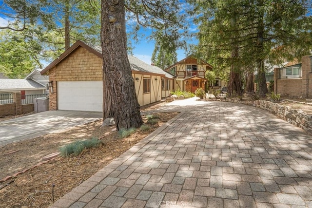 1954 Nob Hill Dr, Running Springs, CA 92382 - view of side of property featuring concrete driveway and an attached garage