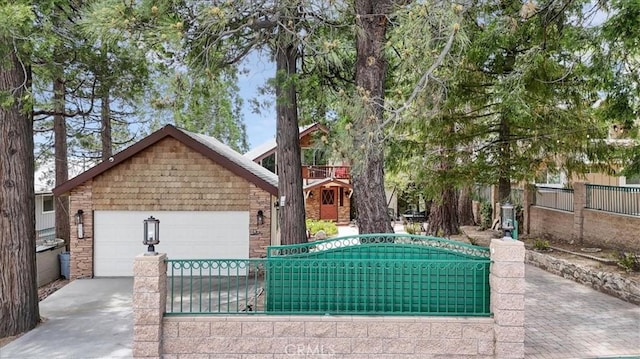 1954 Nob Hill Dr, Running Springs, CA 92382 - view of front of house featuring concrete driveway and an attached garage