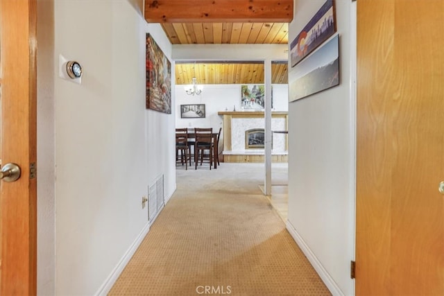 1954 Nob Hill Dr, Running Springs, CA 92382 - corridor featuring carpet, baseboards, and wooden ceiling with exposed beams