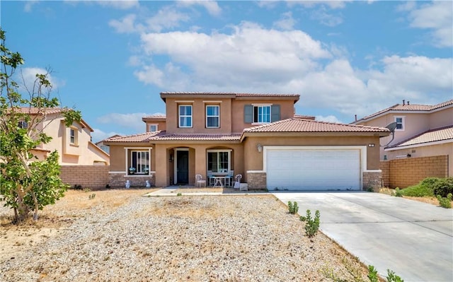 6810 Evans St, Palmdale, CA 93552 - mediterranean / spanish-style house featuring stone siding, concrete driveway, stucco siding, and an attached garage