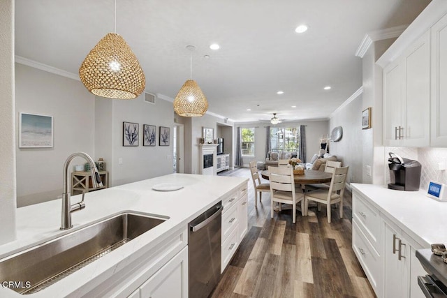 1503 Windshore Way, Oxnard, CA 93035 - kitchen with stainless steel dishwasher, crown molding, a sink, dark wood-type flooring, and pendant lighting