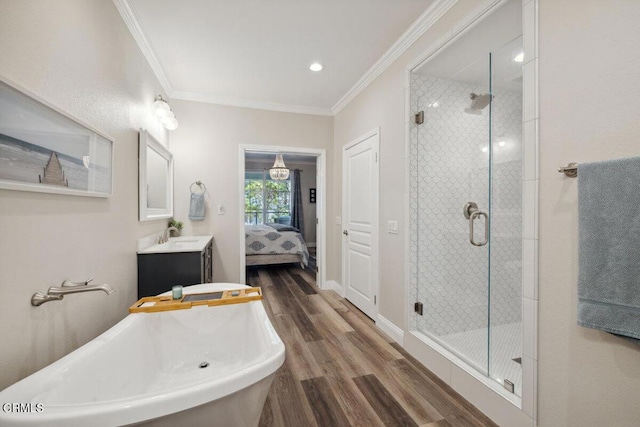 1503 Windshore Way, Oxnard, CA 93035 - ensuite bathroom with a freestanding tub, a shower stall, wood finished floors, ornamental molding, and vanity