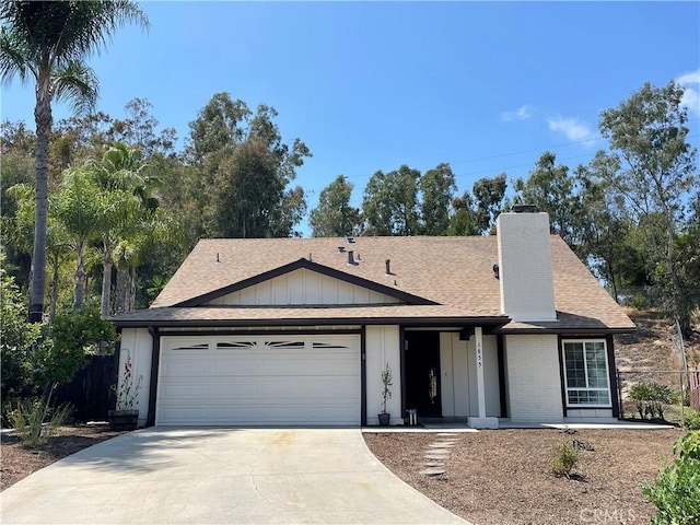 1855 Purdue Ct, Oceanside, CA 92056 - single story home with driveway, an attached garage, a shingled roof, a chimney, and board and batten siding