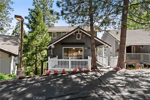 40603 Saddleback Rd, Bass Lake, CA 93604 - view of front of home featuring covered porch and a tiled roof
