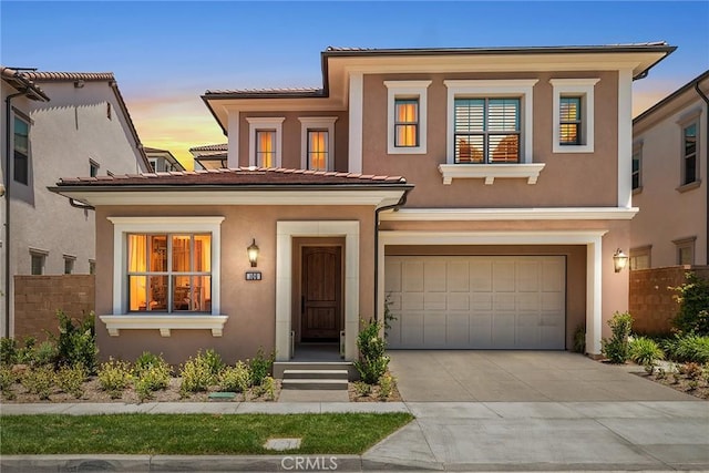 106 Bright Star, Irvine, CA 92618 - mediterranean / spanish house featuring an attached garage, stucco siding, concrete driveway, and a tile roof