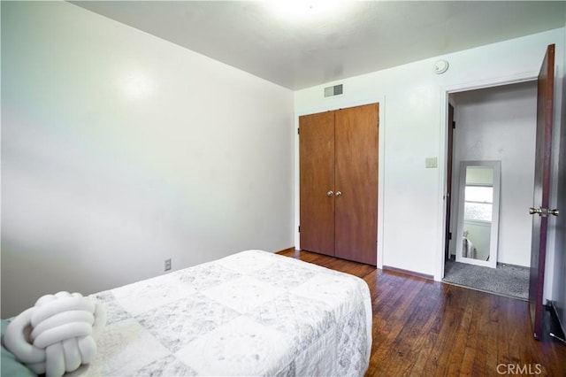 10655 Banner Lava Cap Rd, Nevada City, CA 95959 - bedroom with wood finished floors, a closet, and baseboards