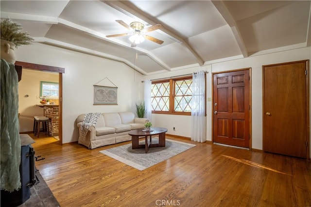 10655 Banner Lava Cap Rd, Nevada City, CA 95959 - living area featuring lofted ceiling, healthy amount of natural light, a ceiling fan, a wood stove, and wood finished floors