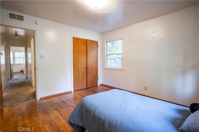 10655 Banner Lava Cap Rd, Nevada City, CA 95959 - bedroom with baseboards, wood finished floors, and a closet