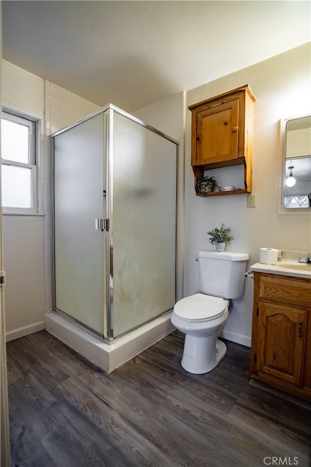 10655 Banner Lava Cap Rd, Nevada City, CA 95959 - bathroom featuring vanity, wood finished floors, toilet, and a shower stall