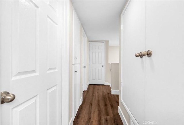 18743 Club Ln, Huntington Beach, CA 92648 - hallway with dark wood-type flooring and baseboards