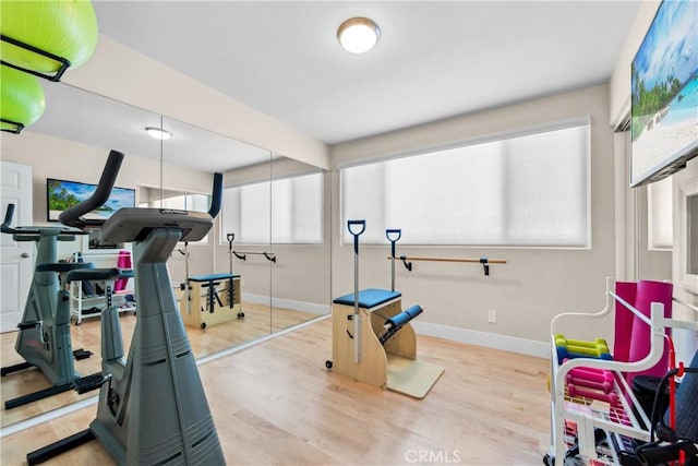 18743 Club Ln, Huntington Beach, CA 92648 - workout area featuring wood finished floors and baseboards