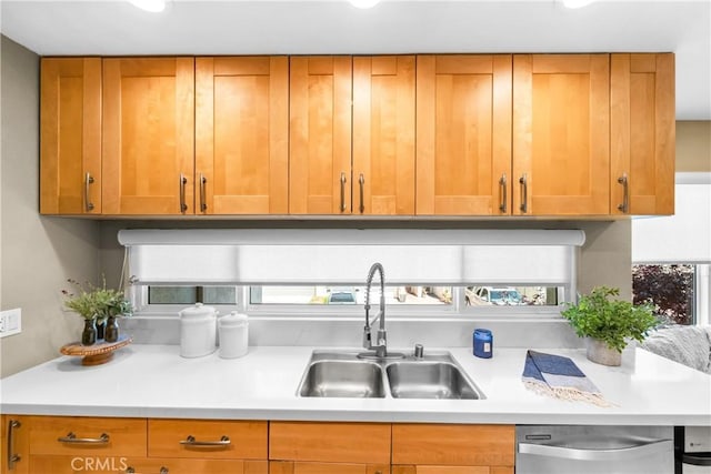 18743 Club Ln, Huntington Beach, CA 92648 - kitchen with a sink, stainless steel dishwasher, light countertops, and brown cabinets
