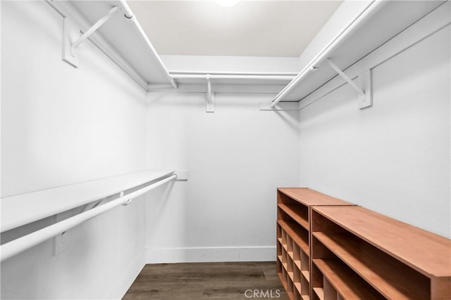 18743 Club Ln, Huntington Beach, CA 92648 - spacious closet featuring dark wood-type flooring