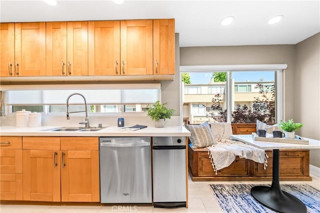 18743 Club Ln, Huntington Beach, CA 92648 - kitchen featuring dishwasher, a sink, light countertops, recessed lighting, and light tile patterned flooring
