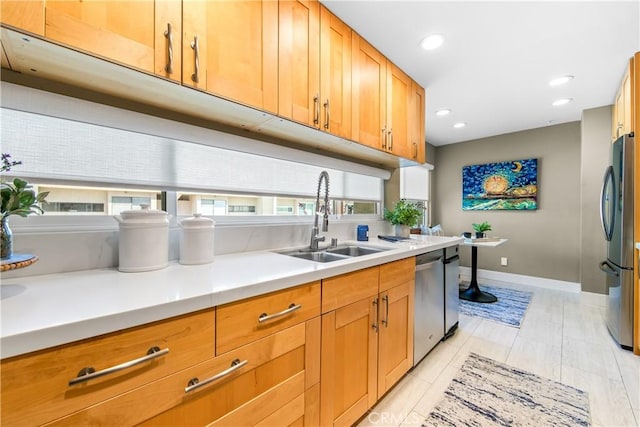 18743 Club Ln, Huntington Beach, CA 92648 - kitchen featuring stainless steel appliances, a sink, baseboards, light countertops, and recessed lighting