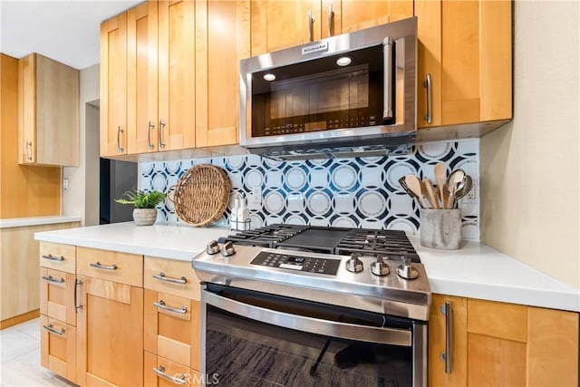 18743 Club Ln, Huntington Beach, CA 92648 - kitchen featuring stainless steel appliances, decorative backsplash, light countertops, and light brown cabinetry