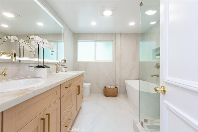 14879 Jadestone Dr, Sherman Oaks, CA 91403 - full bath with double vanity, a freestanding tub, toilet, a marble finish shower, and marble finish floors