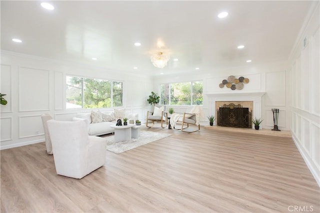 14879 Jadestone Dr, Sherman Oaks, CA 91403 - living room with a decorative wall, recessed lighting, a fireplace, light wood finished floors, and crown molding