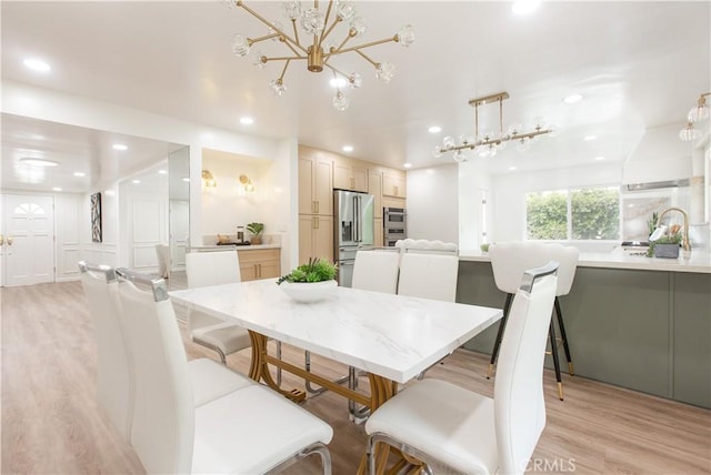 14879 Jadestone Dr, Sherman Oaks, CA 91403 - dining room with recessed lighting, light wood-style flooring, and a chandelier