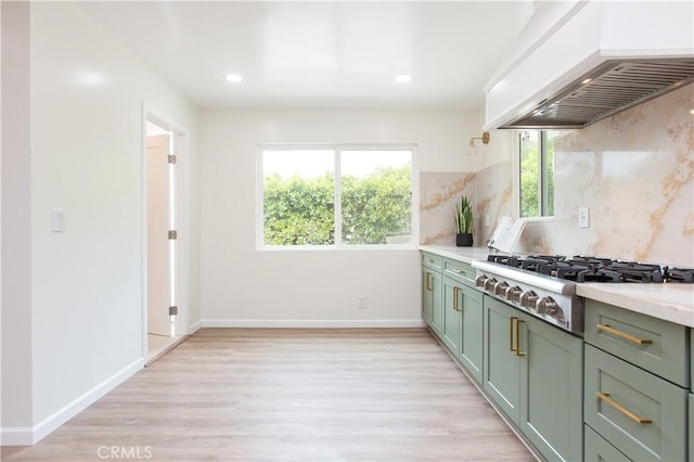 14879 Jadestone Dr, Sherman Oaks, CA 91403 - kitchen with custom range hood, stainless steel gas cooktop, green cabinets, light wood-type flooring, and light countertops