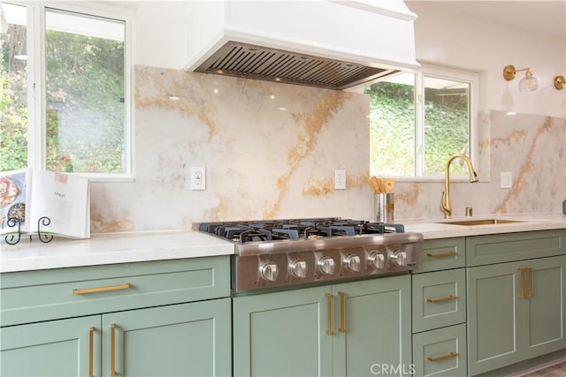 14879 Jadestone Dr, Sherman Oaks, CA 91403 - kitchen with green cabinetry, stainless steel gas cooktop, a sink, and custom exhaust hood