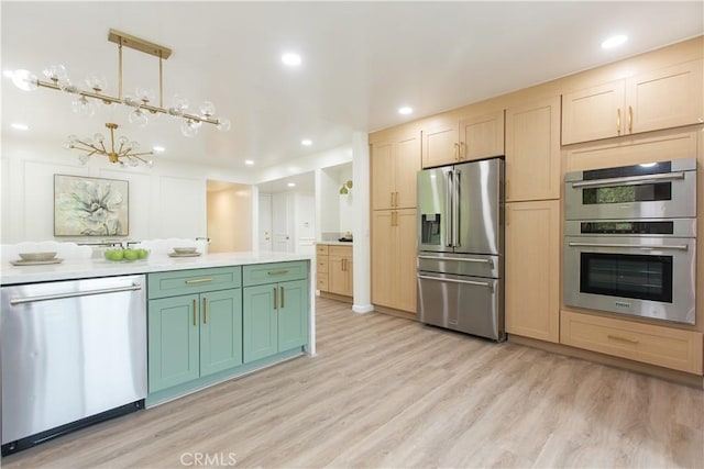14879 Jadestone Dr, Sherman Oaks, CA 91403 - kitchen featuring appliances with stainless steel finishes, light wood finished floors, light brown cabinetry, light countertops, and recessed lighting
