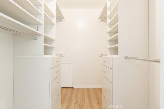14879 Jadestone Dr, Sherman Oaks, CA 91403 - walk in closet featuring light wood-style floors