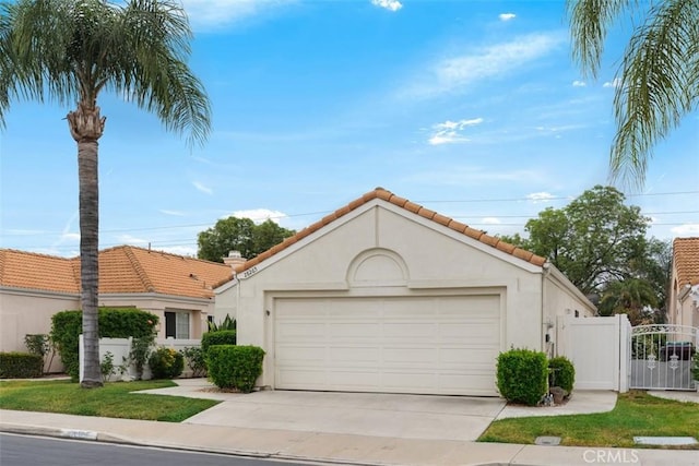 28265 Valombrosa Dr, Menifee, CA 92584 - mediterranean / spanish home with concrete driveway, stucco siding, a garage, and a tile roof