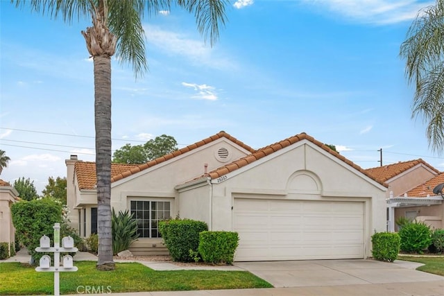 28265 Valombrosa Dr, Menifee, CA 92584 - mediterranean / spanish house with a garage, stucco siding, concrete driveway, and a tile roof