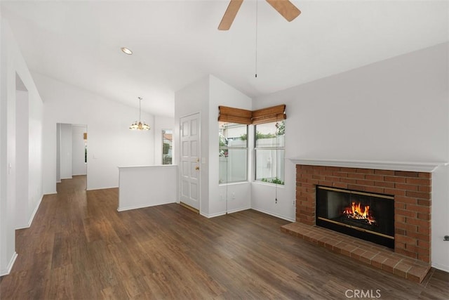 28265 Valombrosa Dr, Menifee, CA 92584 - unfurnished living room with lofted ceiling, wood finished floors, a brick fireplace, a chandelier, and ceiling fan