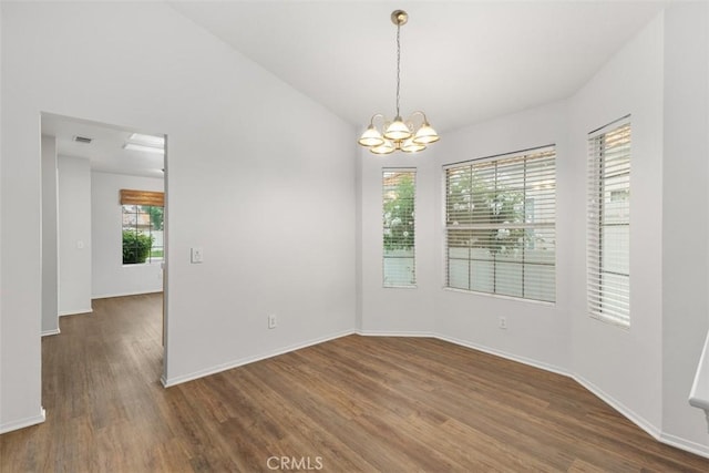 28265 Valombrosa Dr, Menifee, CA 92584 - unfurnished room with a chandelier, wood finished floors, and baseboards