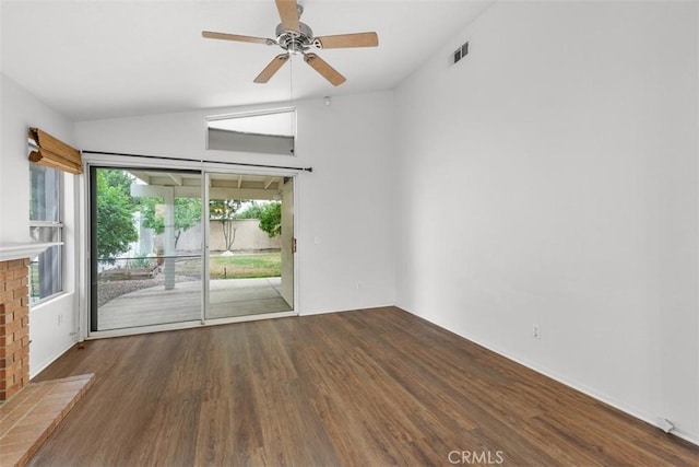 28265 Valombrosa Dr, Menifee, CA 92584 - unfurnished room featuring wood finished floors, vaulted ceiling, a ceiling fan, and a brick fireplace