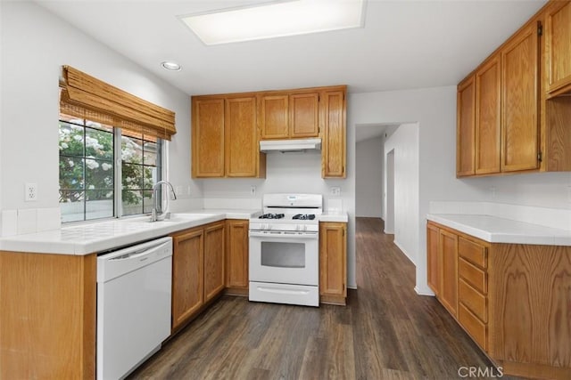28265 Valombrosa Dr, Menifee, CA 92584 - kitchen with white appliances, under cabinet range hood, dark wood-type flooring, a sink, and light countertops