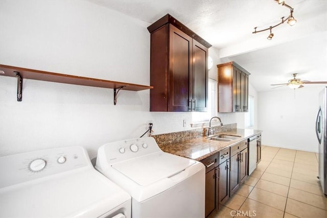 44128 Stanridge Ave, Lancaster, CA 93535 - washroom featuring independent washer and dryer, ceiling fan, and light tile patterned flooring