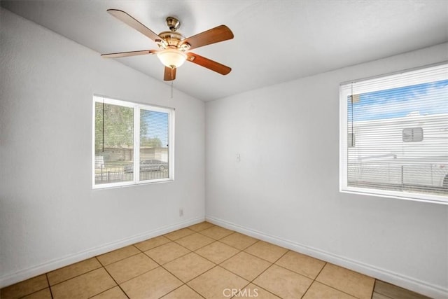 44128 Stanridge Ave, Lancaster, CA 93535 - empty room with vaulted ceiling, a ceiling fan, baseboards, and light tile patterned floors