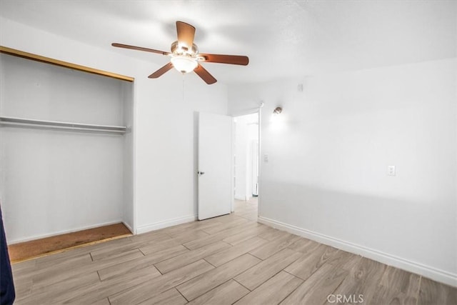 44128 Stanridge Ave, Lancaster, CA 93535 - unfurnished bedroom featuring wood finished floors, a closet, baseboards, and ceiling fan