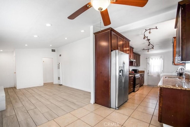 44128 Stanridge Ave, Lancaster, CA 93535 - kitchen featuring stainless steel appliances, a sink, ceiling fan, light stone countertops, and open floor plan