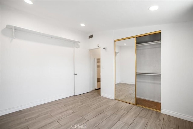 44128 Stanridge Ave, Lancaster, CA 93535 - unfurnished bedroom featuring recessed lighting, wood finished floors, a closet, and baseboards