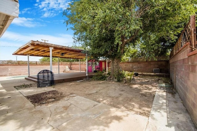 44128 Stanridge Ave, Lancaster, CA 93535 - fenced backyard with a patio, an outdoor structure, and a swimming pool