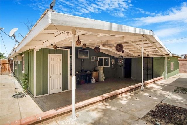 44128 Stanridge Ave, Lancaster, CA 93535 - rear view of property featuring board and batten siding