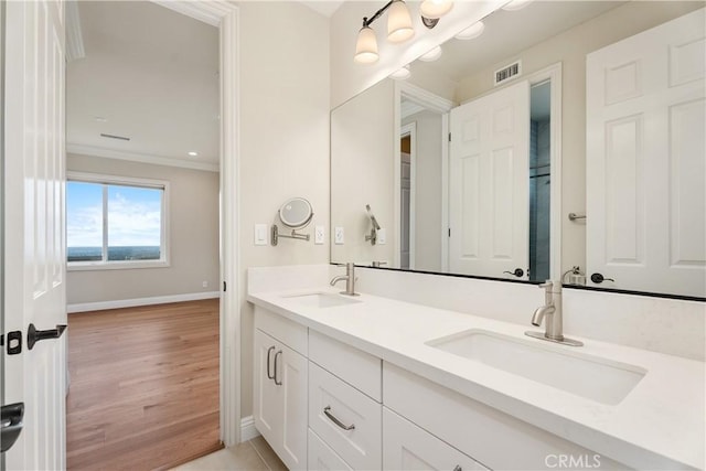 18762 Pimlico, Yorba Linda, CA 92886 - bathroom with double vanity, crown molding, baseboards, and wood finished floors