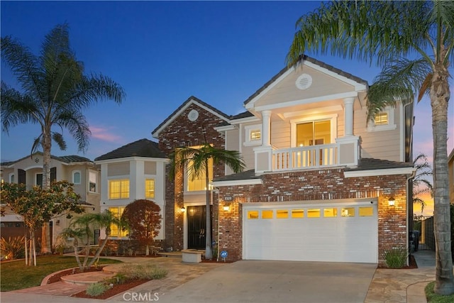 18762 Pimlico, Yorba Linda, CA 92886 - view of front of home featuring an attached garage, brick siding, driveway, and a balcony