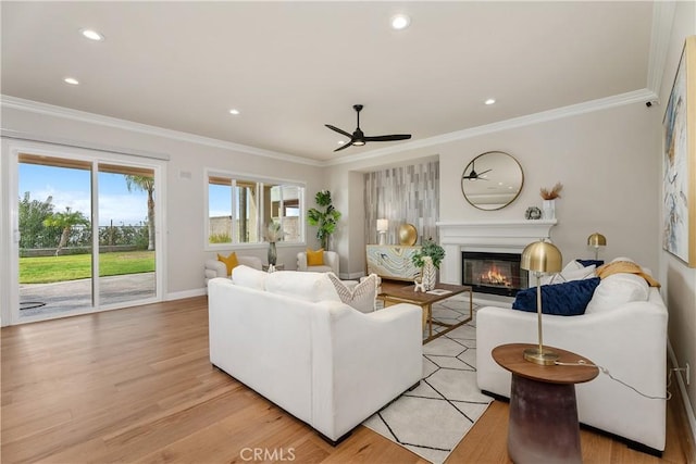18762 Pimlico, Yorba Linda, CA 92886 - living area featuring ceiling fan, a glass covered fireplace, ornamental molding, light wood-style flooring, and recessed lighting