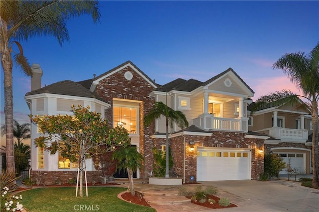 18762 Pimlico, Yorba Linda, CA 92886 - view of front of property with brick siding, driveway, an attached garage, and a balcony